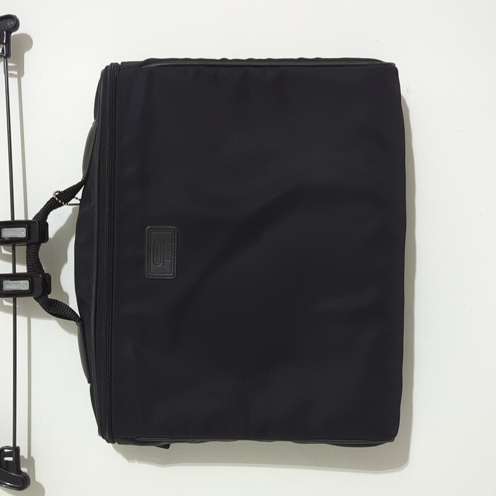 Coach laptop bag 12.5x10x2.5 black in color